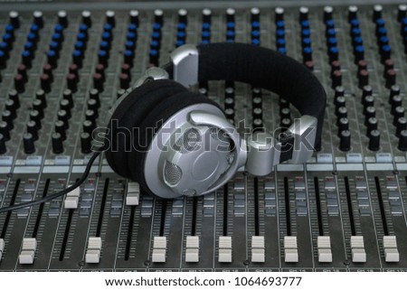 headphone on sound mixer, music background, sound engineer