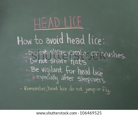 Head lice healthcare information on chalkboard