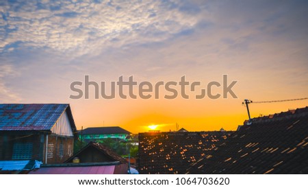 Sunrise from the crack of the tile House