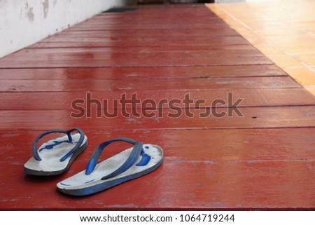 old sandals on wood floor. Royalty-Free Stock Photo #1064719244