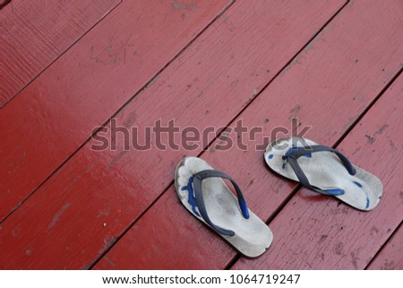 old sandals on wood floor. Royalty-Free Stock Photo #1064719247