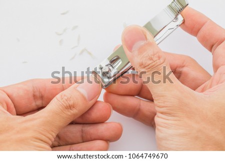 Man cuts his nails with tweezers on a white background. Nail care illustration For their good hygiene.