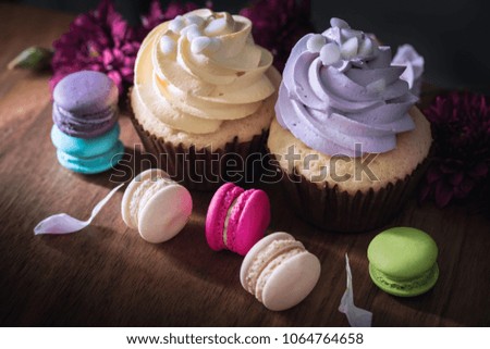 macarons or macaroons and cupcakes on wooden dessert sweet beautiful to eat.