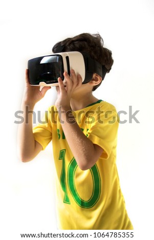 Cute boy with VR Glasses over white background. Kid cheering watching virtual game. 3d technology, virtual reality, sport, entertainment and people concept 