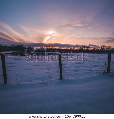 sunsetting at the farm. fresh snow on the ground. landscape photography 