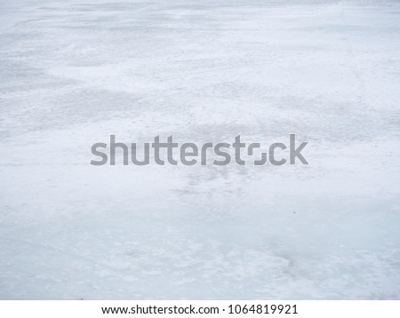 White ice on the lake in the spring. Natural background.