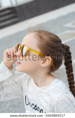 Little Girl Kid Looking Up Yellow Sunglasses Close Up Summer Portret smiling 7 Years old Girl