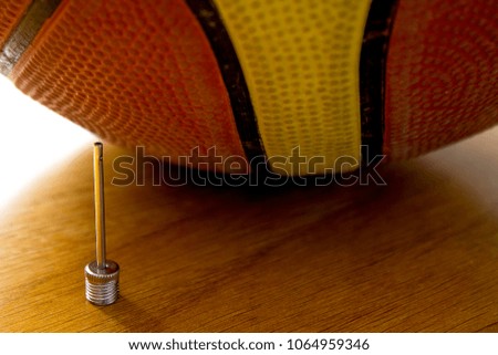 needle for basketball and the ball closeup