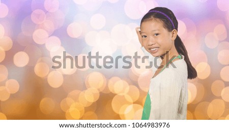 Smiling girl writing on blurred background