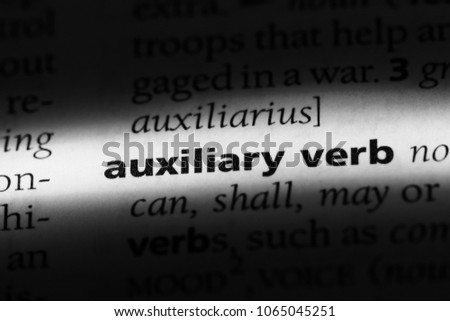 auxiliary verb word in a dictionary. auxiliary verb concept. Royalty-Free Stock Photo #1065045251