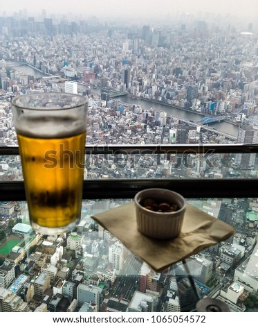Beer and nuts overlooking tokyo