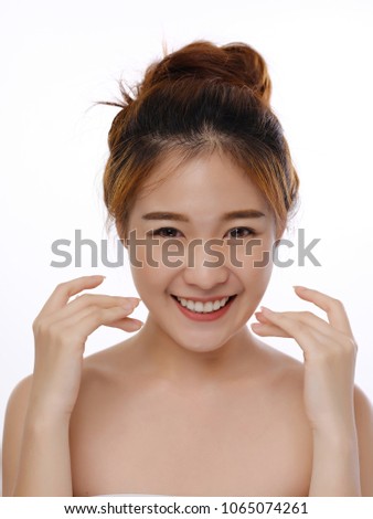 Close up picture. beautiful young Asian woman with clean face. Beauty model girl with perfect fresh clean skin . Youth and skin care concept.Isolated on a white background