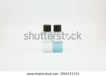 Shower gel and shampoo in small square bottle, black lid on a white background