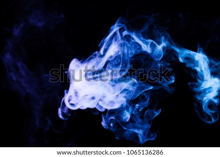 Blue cloud of smoke of  black isolated background. Background from the smoke of vape