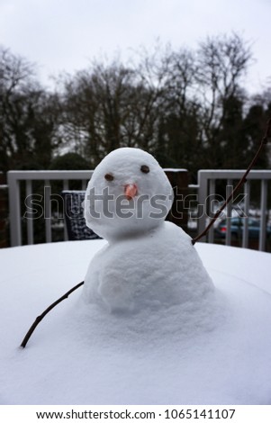 Close up Little snowman on outdoor terrace patio deck