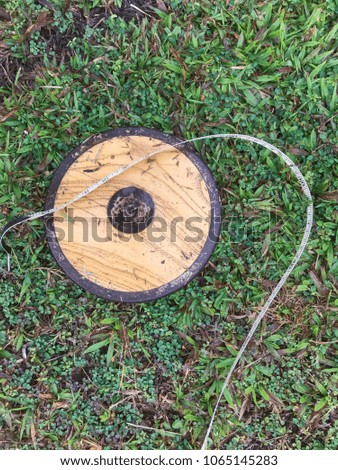 Old discus in field / grass