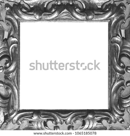 Silver wooden frame with carved ornament. Isolated on white
