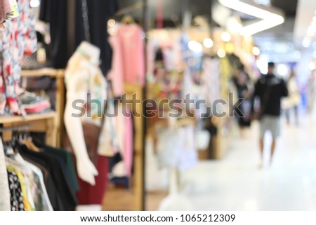 Abstract blur shopping mall in department store interior for background.