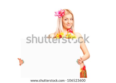 An attractive young woman dressed in a hawaiian costume holding a  panel isolated on white background