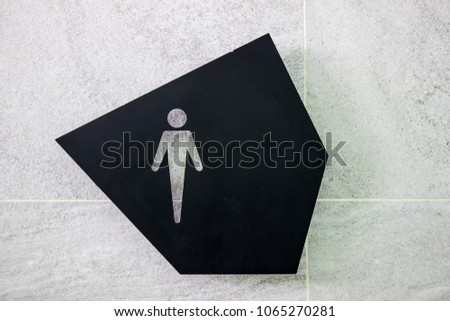 Modern male toilet sign on the wall with copy space for text.