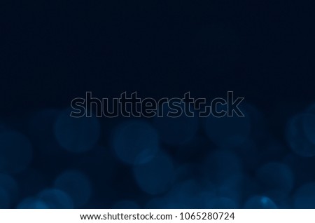 Dark blue abstract bokeh background