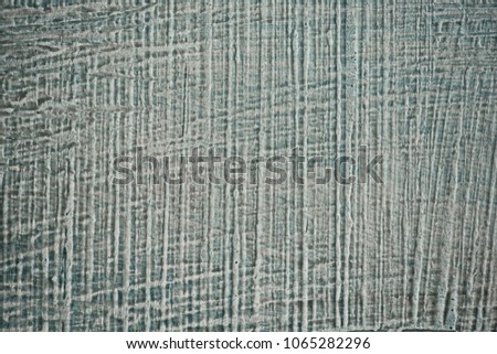 Textured blue - gray wall in the form of jeans.
