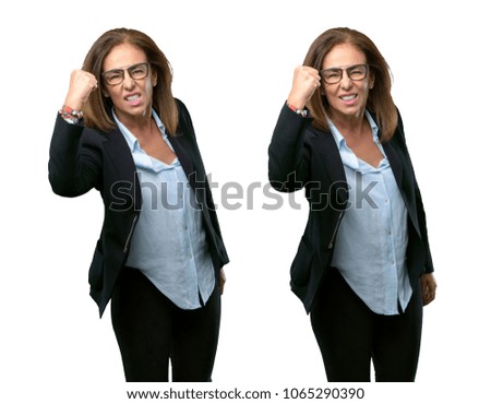 Middle age business woman irritated and angry expressing negative emotion, annoyed with someone over white background