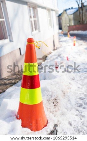 The traffic cones on the street in winter