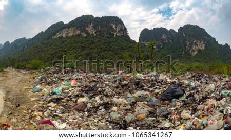 Garbage in paradise.... Illegal dumping ground on the edge of national park in Trang An Vietnam Royalty-Free Stock Photo #1065341267
