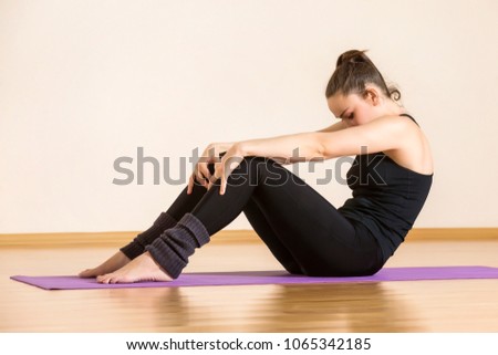 Woman is doing pilates exercises at gym. Concept of healthcare lifestyle.