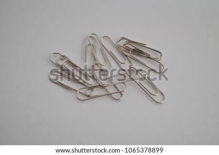 steel stationery clips on a white background