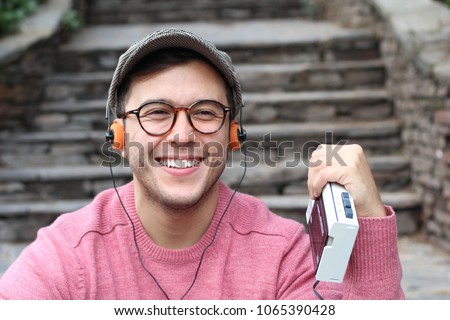 Reviving the eighties with a Walkman Royalty-Free Stock Photo #1065390428