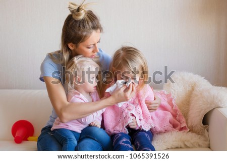 Mother taking care of her sick child Royalty-Free Stock Photo #1065391526