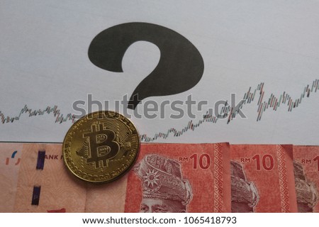 A golden bitcoin with graph and money background. Bitcoin price rise abstraction. Trading concept of crypto currency. Question Mark. 
