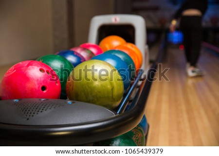 Multicolored bowling balls on a stand