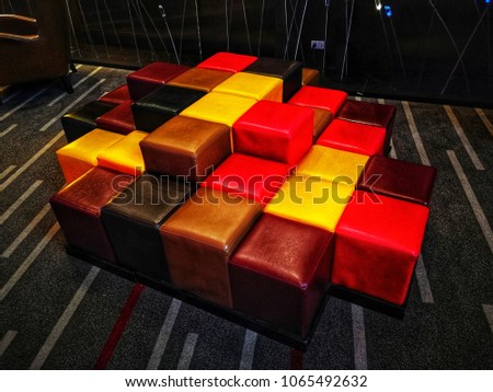 multi color chairs the area in front of theatre for customer to sit between waiting movie show