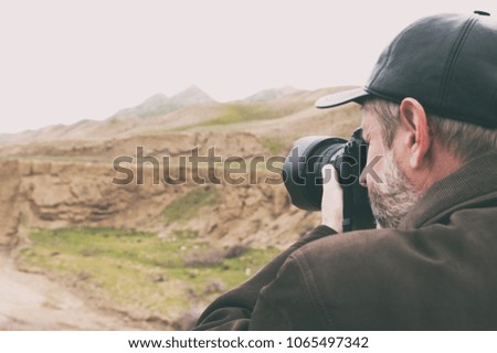 Landscape photographer in mountains area