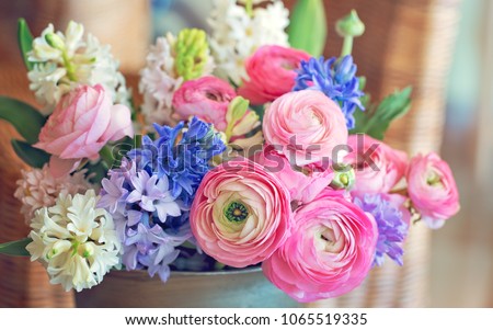 Beautiful bouquet of spring flowers in a vase on the table. Lovely bunch of flowers . 