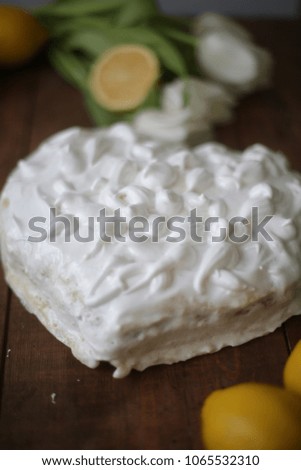Lemon cake with a French meringue in the form of a heart.