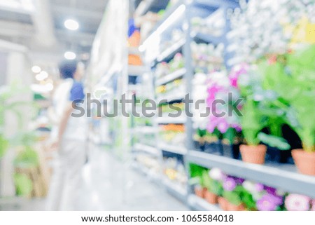 Blured or defocused photography of modern department store.Perspective of shelf with many goods or product.Shopping business background concept.