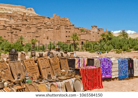 View of craft stalls with the Ait Ben Haddou Kasbah in Morocco, Africa in the background of the picture. Was built in 11th. UNESCO World Heritage Site. 