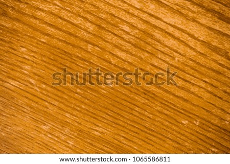 Background image of yellow wooden surface with diagonal lines picture. Plywood close up in macro photography.