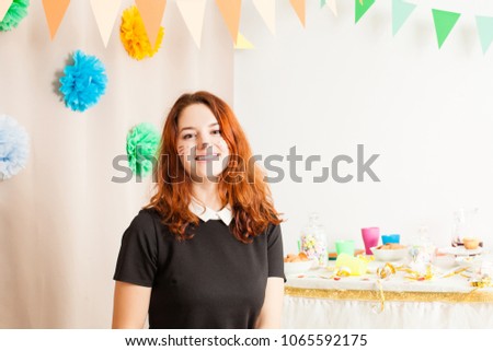 beautiful girl works animator on the birthday party