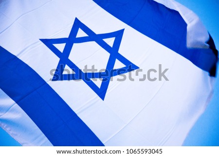 Israel flag waving  on the blue sky background