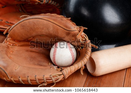 Catcher's mitt, ball, bat and helmet. 
