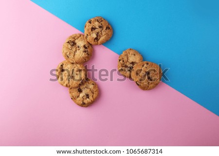 Chocolate cookies flat lay on colored paper. Chocolate chip cookies shot
