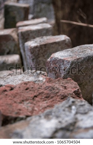 A close up of bricks that have been worn down from old age