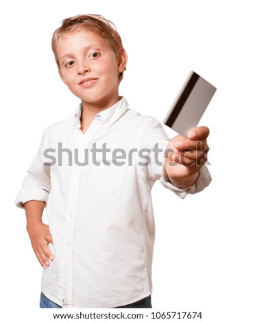 young boy with a credit card against white background