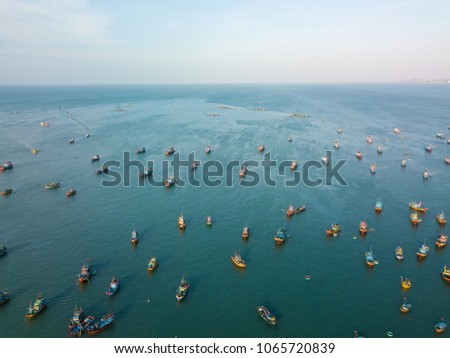 Top view. Aerial view fishing harbour market from drone. Royalty high quality free stock image of market at Mui Ne fishing harbour or fishing village. Fishing harbor is a popular tourist destination
