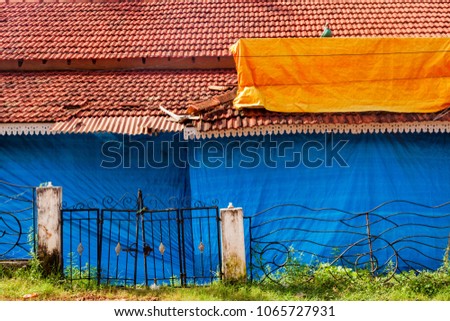 Traditional blue and red house of Goa, India